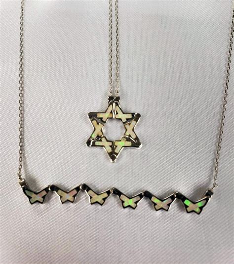Butterfly star of david necklace - The butterfly Star of David necklace can be worn 4 ways - when you open the magnets a butterfly design is seen and when the necklace is closed with the …